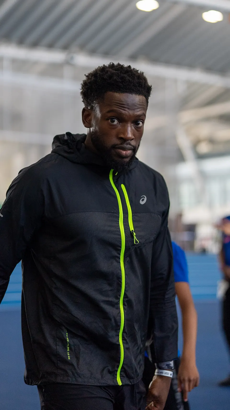 A member in his running jacket at the indoor track